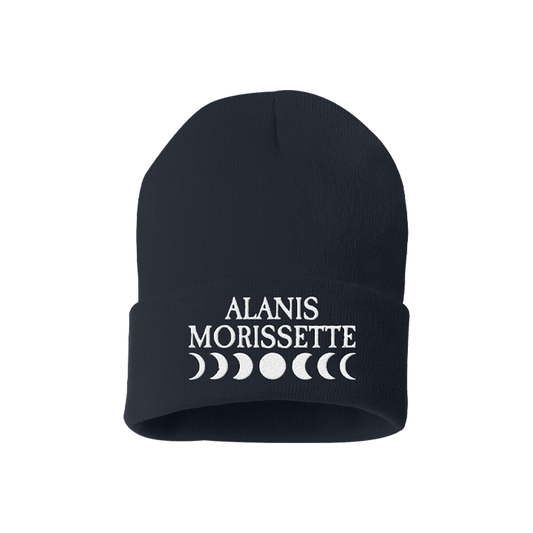 Black knit beanie with ’ALANIS MORISSETTE’ and moon phase symbols embroidered in white.