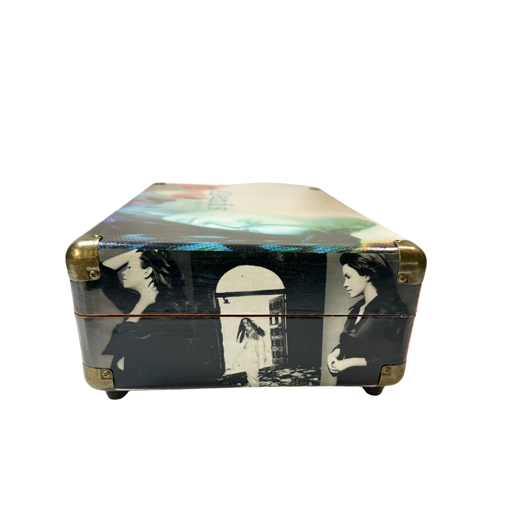 2018 skateboard with black and white graphic design featuring a woman, gold trucks, and blue grip tape.