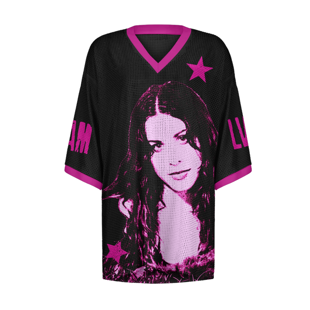 Black mesh jersey with pink stars and text design, likely from a popular brand.