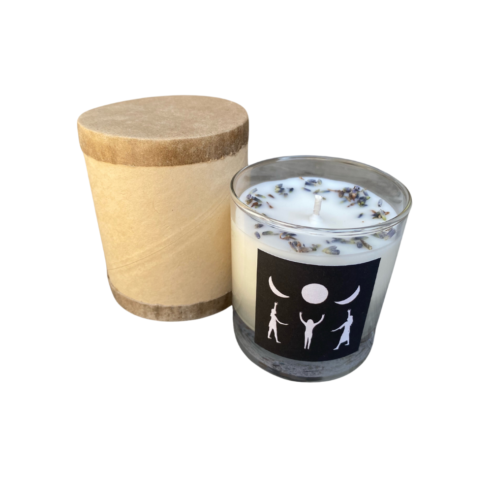 Lavender scented candle with black and white design featuring phases of the moon and figures, housed in a clear glass jar.
